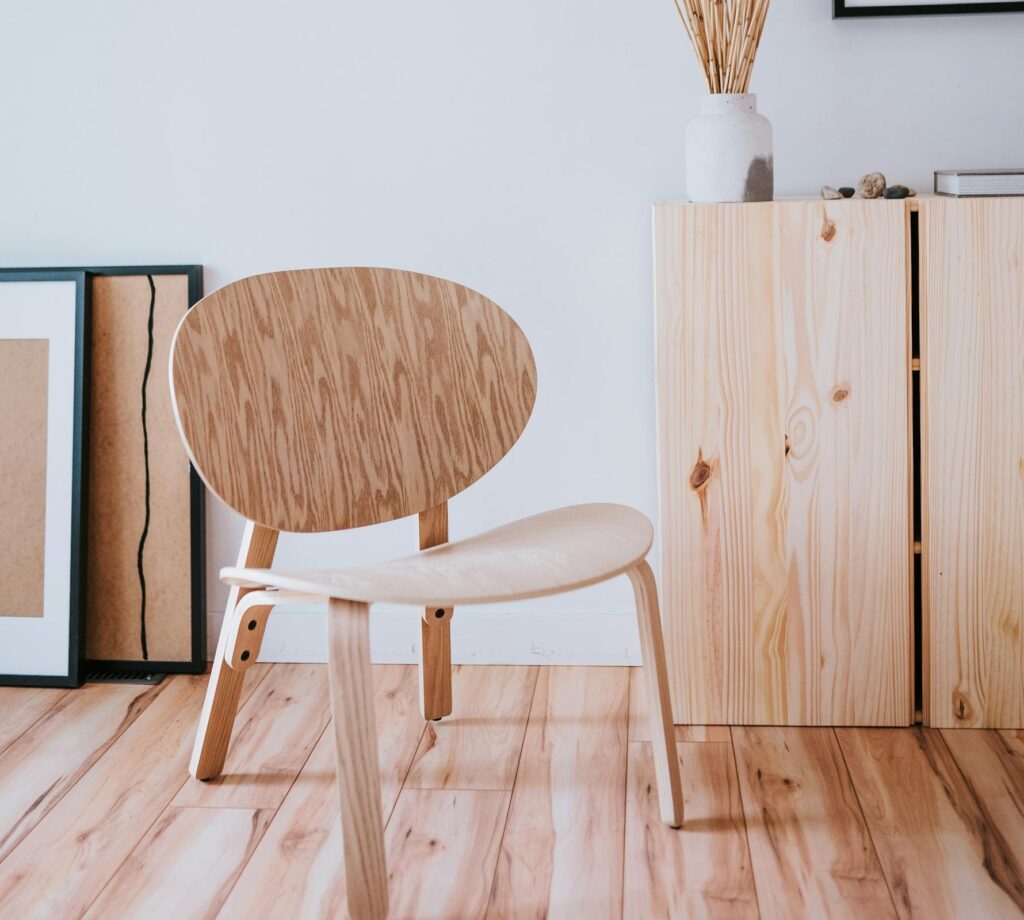 Cozy minimalist room with wooden furniture and simple decor, Scandinavian inspired style.