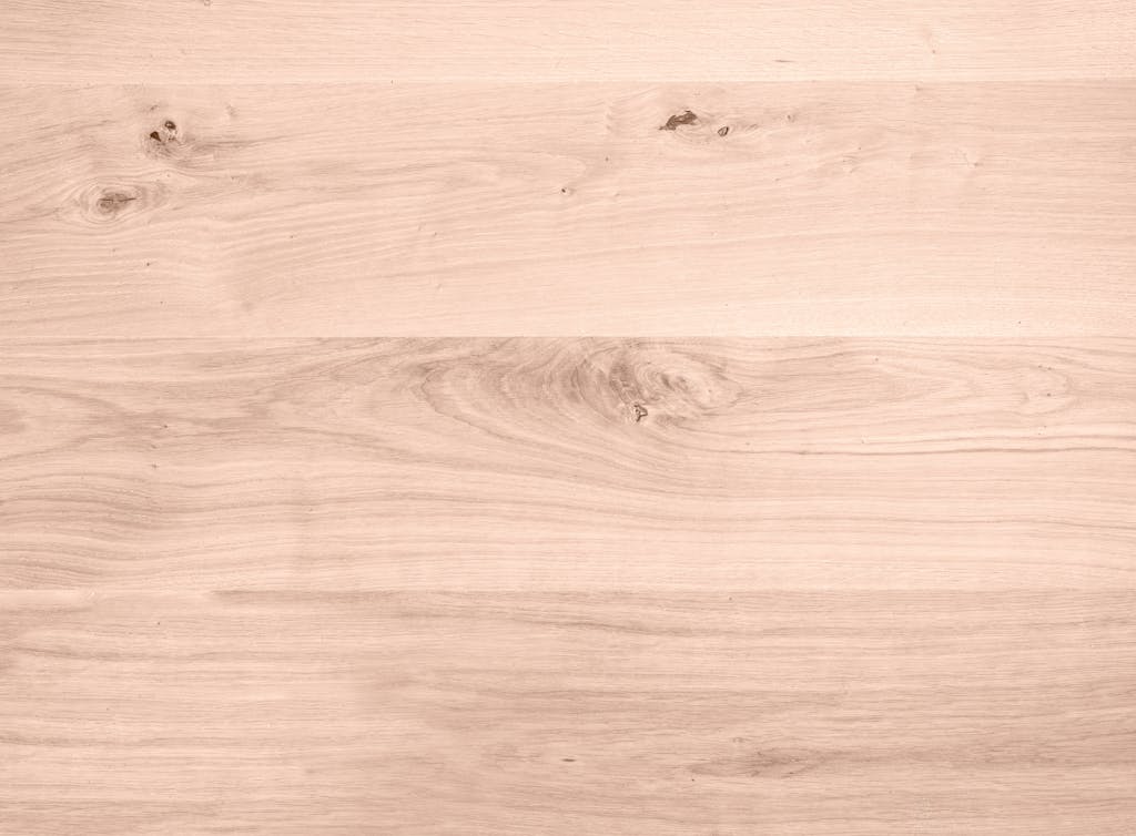 High-resolution close-up of smooth wooden texture, perfect for background use.